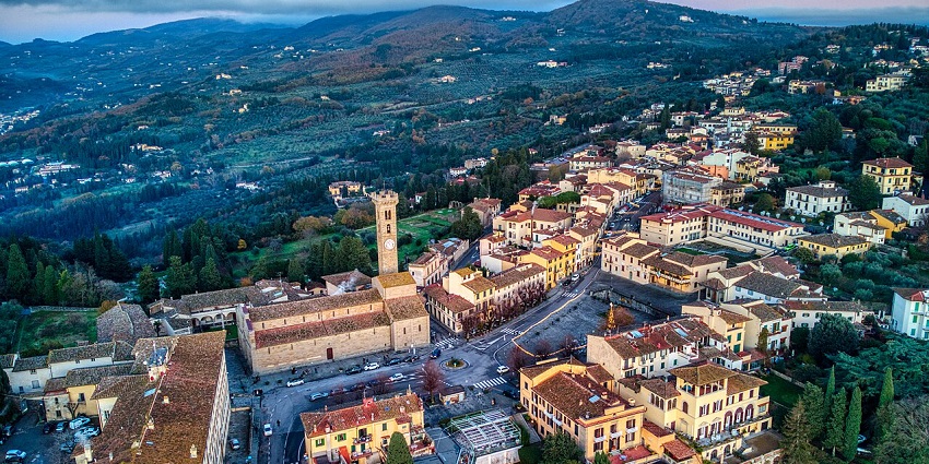 Aerial view of Fiesole village near Florence, featuring historic buildings and lush hills, one of the top places to visit near Florence.
