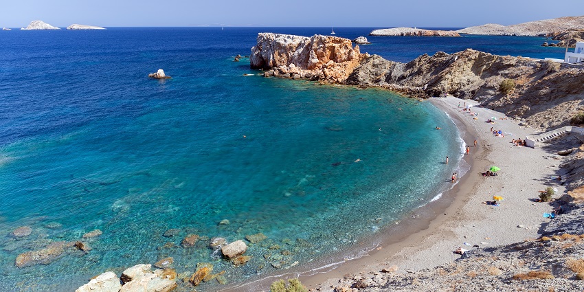 Remote Katergo Beach with turquoise water and rocky cliffs in Folegandros.