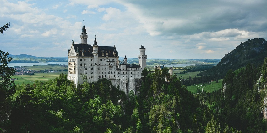 Neuschwanstein Castle in Schwangau, Germany, a stunning fairy-tale landmark surrounded by scenic landscapes.
