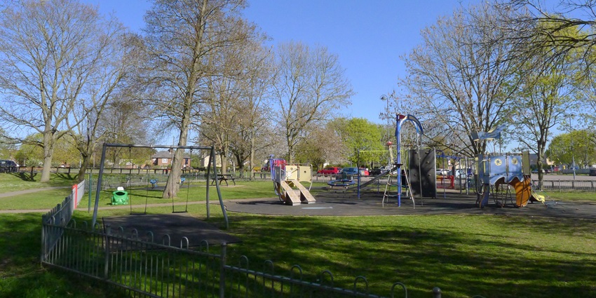 Children's playground with climbing frames and swings in Riverside Park, Huntingdon.