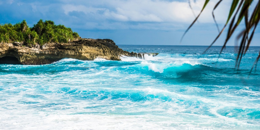 Tropical Lembongan Island in Indonesia with clear blue waters and sandy beaches.