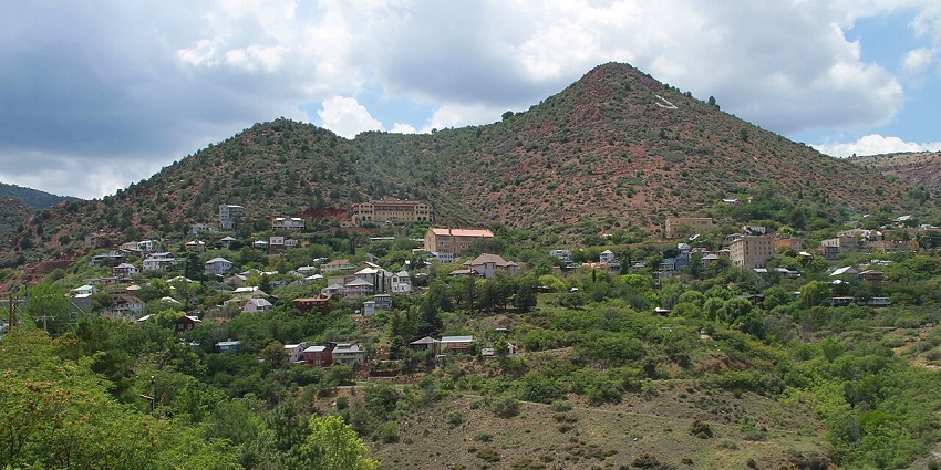 Historic hillside town of Jerome with old buildings and scenic mountain views.