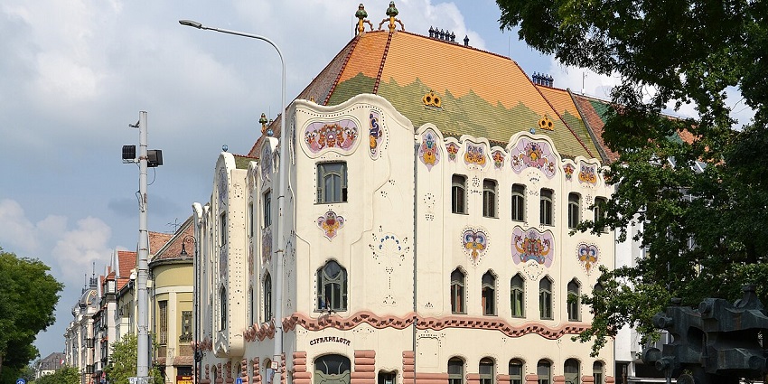 Ornate building with colorful facade, Art Nouveau design, and decorative tiles.