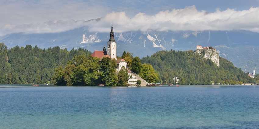 Picturesque church on a peaceful island at Lake Bled, one of the charming places to visit near Ljubljana.