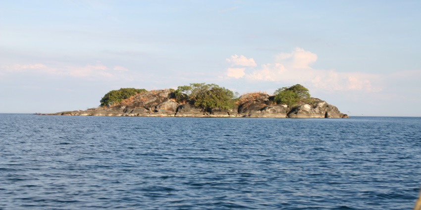 View of Lake Malawi National Park with calm water, one of the top places to visit in Malawi.