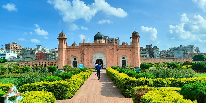 Lalbagh Fort with its red Mughal-era walls, historic gateways, and tranquil garden paths.