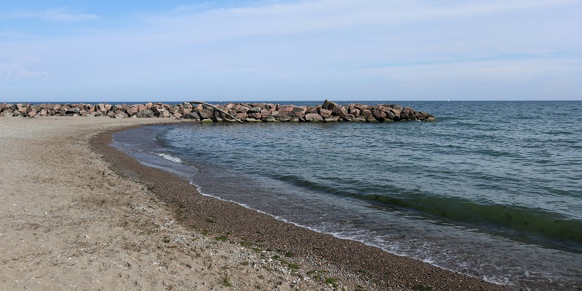 Sandy shore and rocky edge at Lawrencetown Beach, one of the places to visit near Halifax.