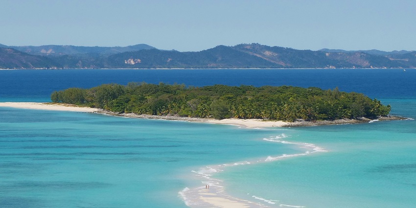 Tropical beach with white sand and turquoise water at Nosy Iranja, Madagascar.
