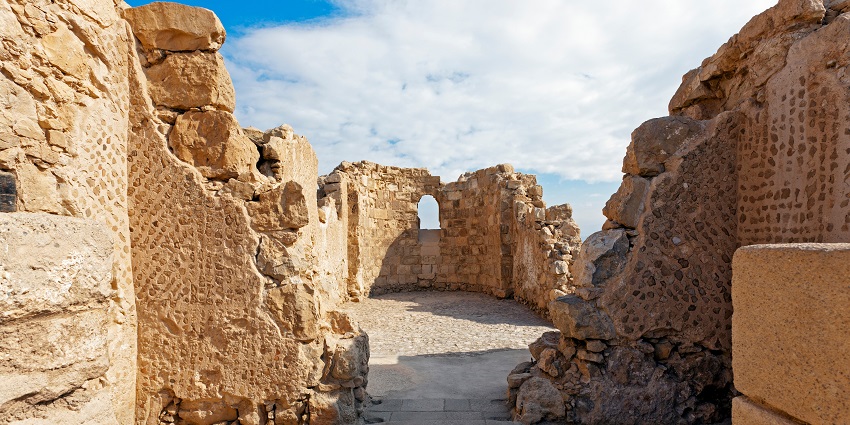 The ancient ruins of the Masada fortress showcase weathered stone walls and historic remains.