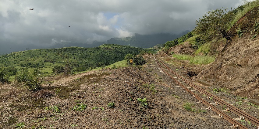Matheran trail with railway track, green hills and clouds among places to visit for 1 night near Mumbai.
