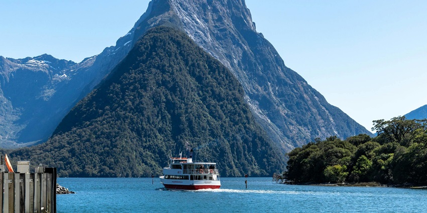 Cruise boat in Milford Sound, among the most iconic places to visit near Queenstown.