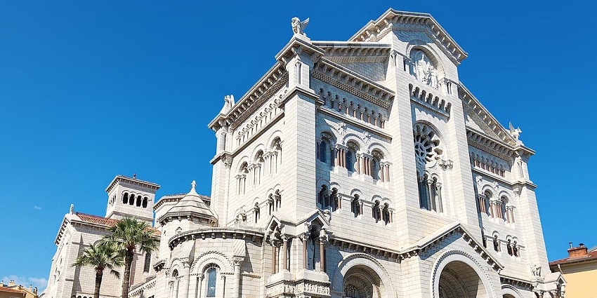 Elegant white stone façade of Monaco’s Notre-Dame Cathedral, among the best places to visit near Switzerland.