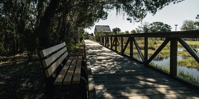 Stroll along a peaceful wooden walkway, one of the relaxing things to do in Hays KS.