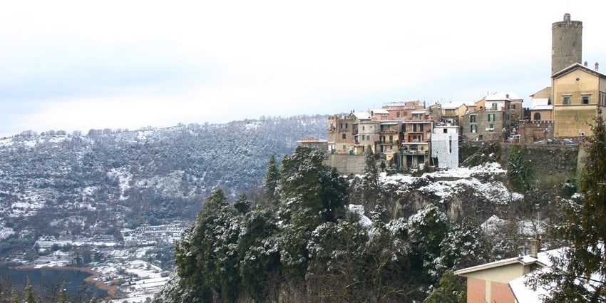 Nemi town on a hill with snow and old architectural buildings places to visit near Rome.
