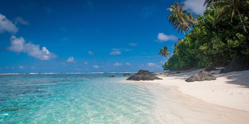 Ofu Beach and Lagoon on Ofu Island with clear turquoise waters and sandy shores.