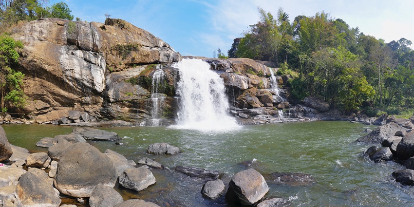 A serene image of a beautiful waterfall resembling the panchvati waterfalls in Andaman