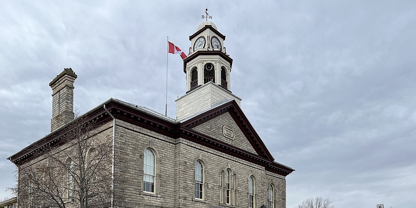 Historic stone buildings line a quiet street in downtown Perth, one of the places to visit near Ottawa.