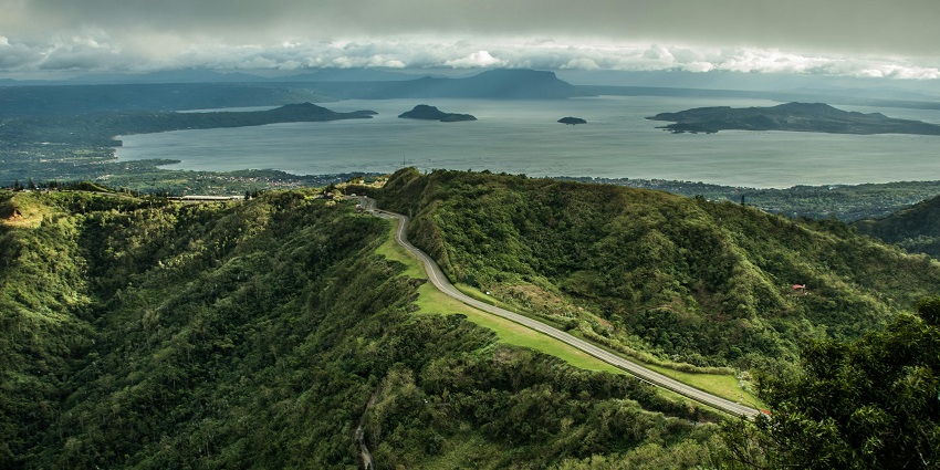 Roads through green mountains in the Philippines, one of the scenic places to visit near Australia.