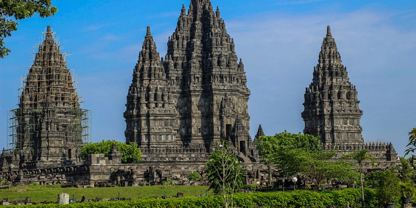 A beautiful ancient temple complex with tall spires and detailed stone carvings.