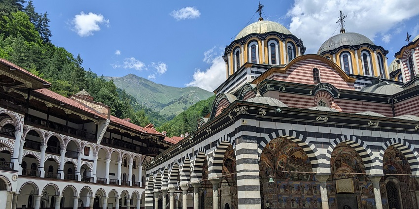 Rila monastery with traditional architecture surrounded by the mountains, one of the top places to visit near Sofia.