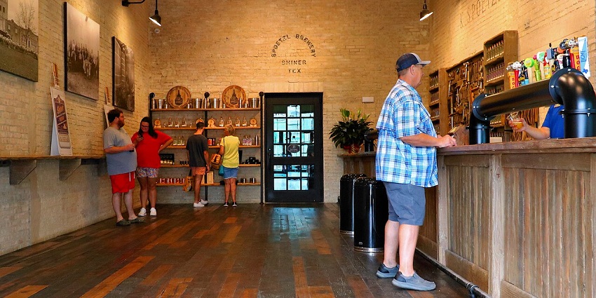 Cosy taproom with people sipping craft beer in a warm and inviting ambiance.