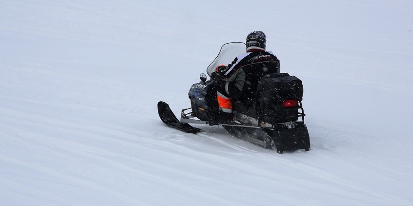 Riding a snowmobile on frozen Lake Inari is one of the most thrilling things to do in Lapland.