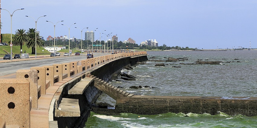 Montevideo’s scenic Rambla has with coastal walkway, ocean views, and people enjoying the waterfront.