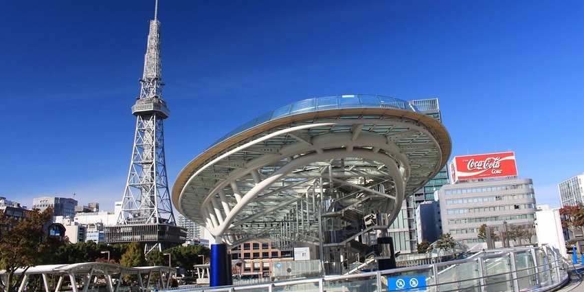 Futuristic, oval-shaped glass and steel building with sleek modern architecture.