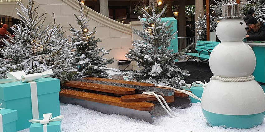 Snowman, snowy Christmas trees, and turquoise gift boxes at Covent Garden festive display.