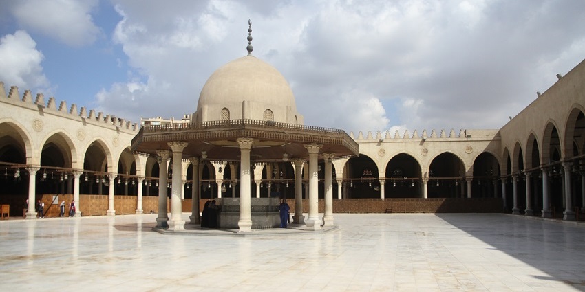Open courtyard with arched colonnades and domed fountain, one of the best things to see in Old Cairo.