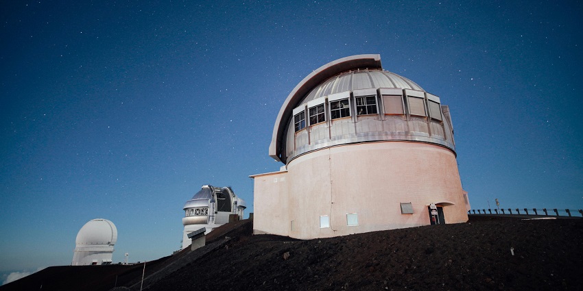 Suffa Plateau Observatory with a large telescope dome surrounded by vast open landscapes.