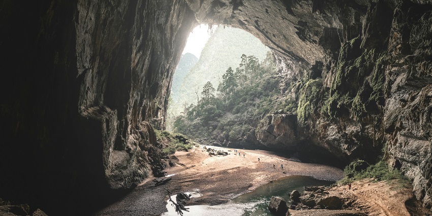 Exploring the dark tunnels and stalactites of Buniayu Caves near Jakarta.
