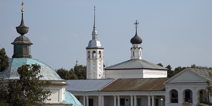 White-stone Kremlin spires and onion-domed churches looking out over green fields.