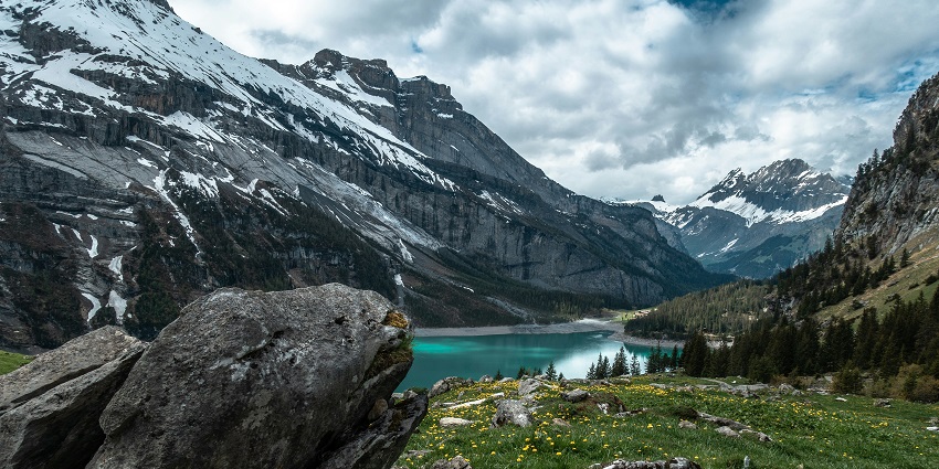 Oeschinen Lake in Switzerland with alpine views and clear waters, one of the best places to visit near Italy.