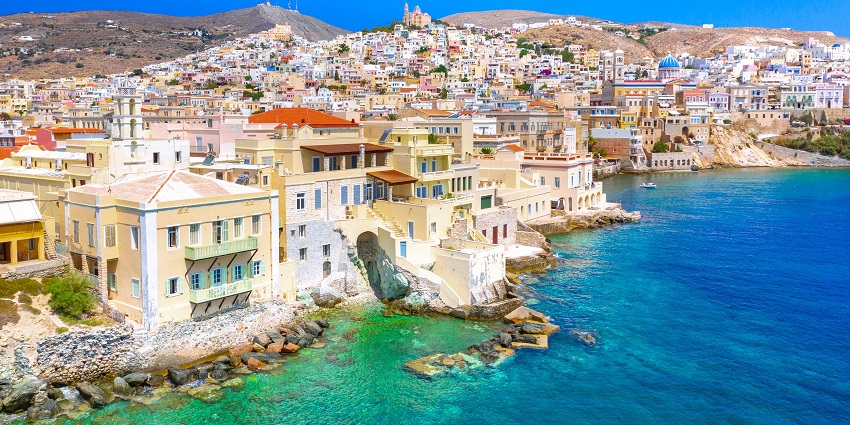 View of Ermoupoli town on Syros island with traditional buildings and harbor.