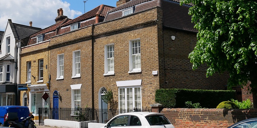 Strolling along Historic brick buildings at Old London Road, one of the things to do in London UK in October.