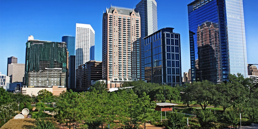 Downtown Houston's glass buildings rise above the green trees of Discovery Green Park.
Viewers of this file can see comments and suggestions
