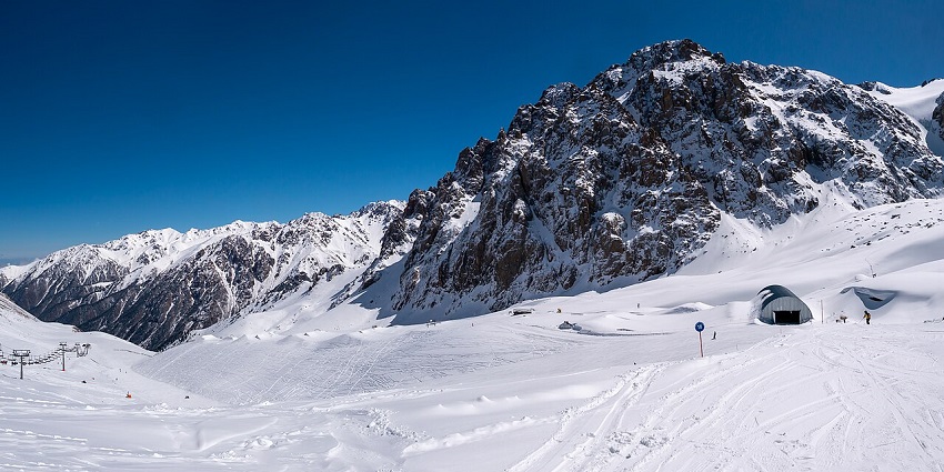 Talgar Pass at Shymbulak with snow-covered mountains, ski trails, among the best places to visit near Almaty.