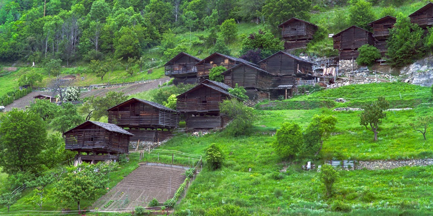 Traditional Rungus longhouse in Tampakan Village with bamboo walls and stilted floor.