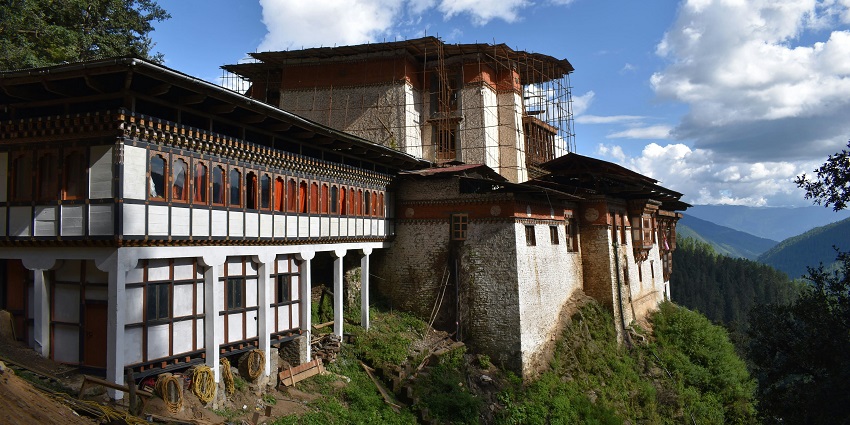 Tango Monastery surrounded by forested hills, known for its peaceful atmosphere.