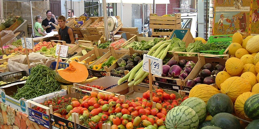 Ballarò Market in Palermo with multiple vibrant & colourful fruits and vegetables.
