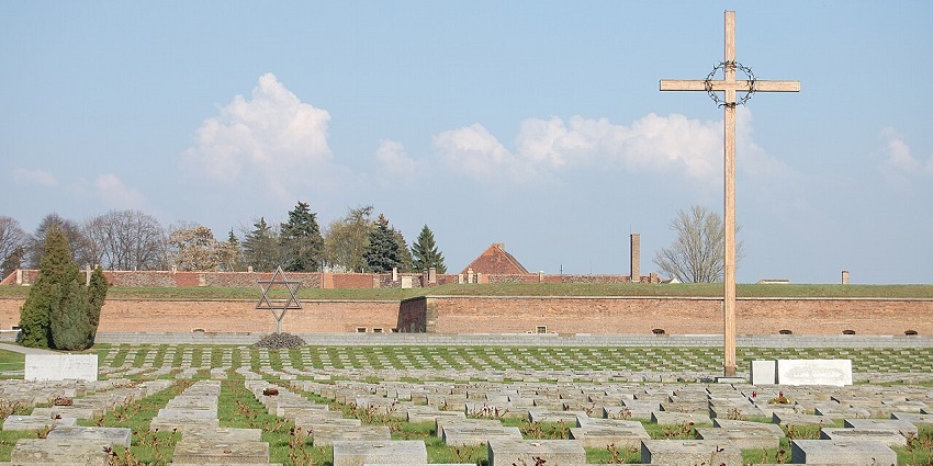 A solemn cemetery with uniform headstones, a wooden cross, and a Star of David memorial.