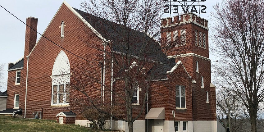 Exterior view of Shepherd of the Hills Episcopal Church with its peaceful surroundings.
