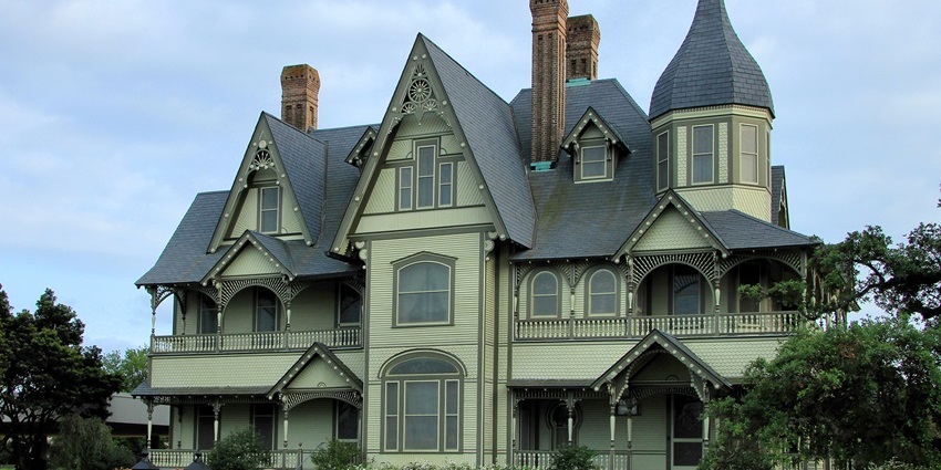 Elegant Victorian-style house with intricate woodwork, multiple gables, and a tall turret, one of the best things to see in Orange Texas.