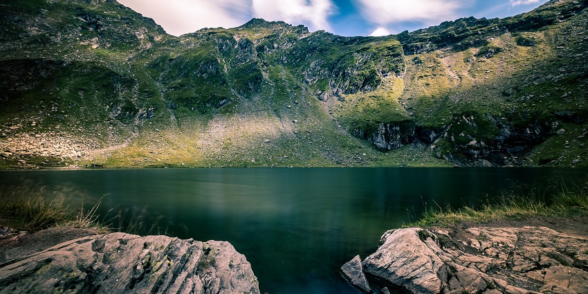 Balea Lake glistening among mountain peaks, amongst the top places to visit near Bucharest.