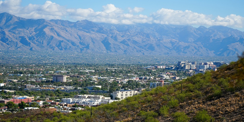 Tucson cityscape with desert mountains in the background, a top place to visit near Phoenix.