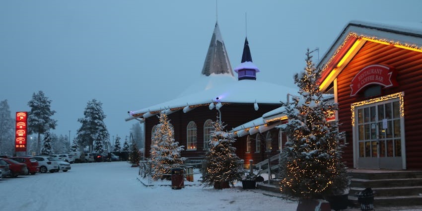 Santa Claus’ Village in Rovaniemi, with snowy rooftops and a festive winter landscape.