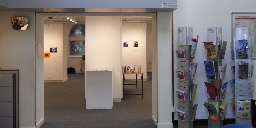 Exhibition hall at Hong Kong Visual Arts Centre with art displayed on white gallery walls.