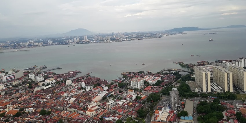 Enjoy the scenic view of Penang Island from The TOP at KOMTAR, showing the city and coastline, one of the best things to do in Malaysia with family.