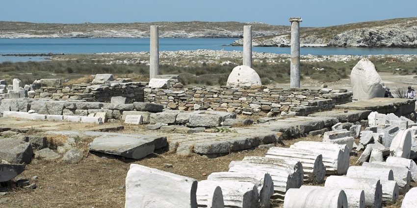 Exploring ancient temple ruins with standing columns is one of the things to do in Mykonos in June.
